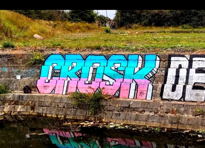 Canal graffiti reflection